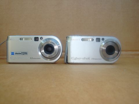 1993 Ford Taurus - Two Sony Cyber-shot digital cameras are shown against a plain background.