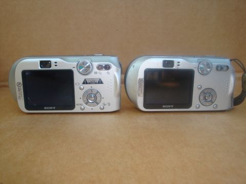 1993 Ford Taurus - Two Sony digital cameras are shown from the rear, with one on the left and another on the right.