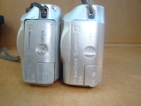 1993 Ford Taurus - Comparison of two digital cameras, highlighting their external markings and construction details.