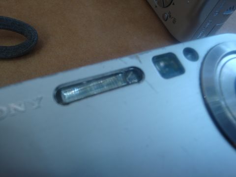 1993 Ford Taurus - Detail of a Sony digital camera, showing the flash and part of the lens assembly.