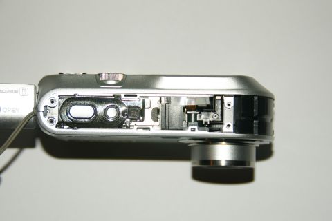 1993 Ford Taurus - Close-up view of the internal mechanisms and circuitry of a disassembled digital camera.
