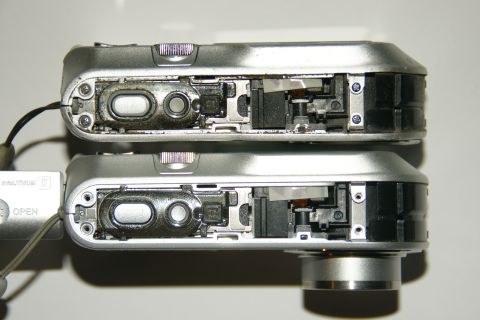 1993 Ford Taurus - Close-up view of the battery compartments and internal workings of two digital cameras.