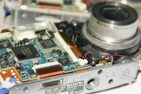1993 Ford Taurus - Internal components of a Sony DSC-P200 digital camera, showing circuit boards and lens mechanism.