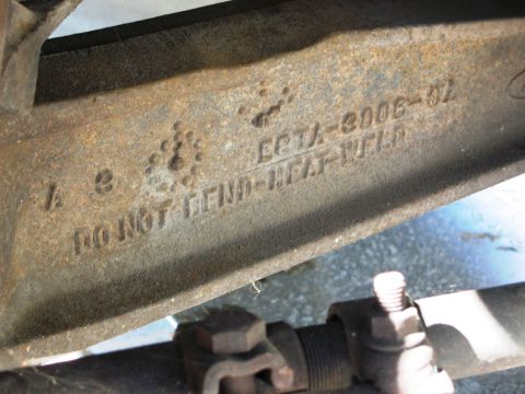 1986 Ford Bronco - This part has stamped text including a part number and instructions not to bend or heat weld it.