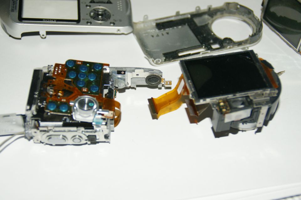Sony digital camera disassembled, showing circuit boards and screen