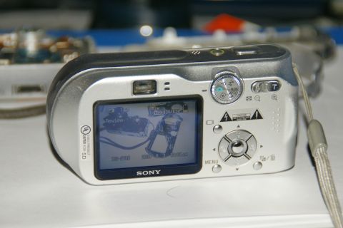 1993 Ford Taurus - This Sony digital camera is shown from the back, displaying its review screen with camera settings.