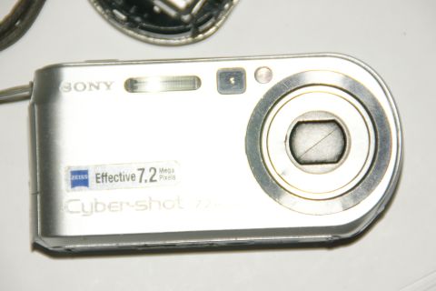 1993 Ford Taurus - A silver Sony Cyber-shot digital camera is shown, a Zeiss lens and 7.2 megapixel capability.