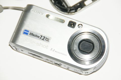 1993 Ford Taurus - Close-up of a silver Sony Cyber-shot digital camera, showing the lens and branding.