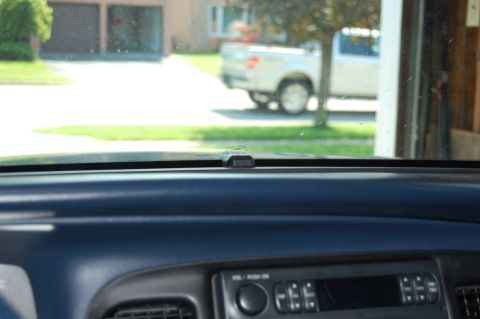1985 Mercury Grand Marquis - Interior view from the dashboard shows a white pickup truck parked outside.