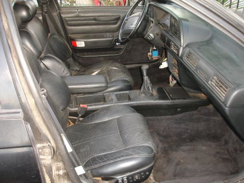 1991 Ford Taurus - Interior view of a 1991 Ford Taurus, highlighting the condition of the seats and dashboard.