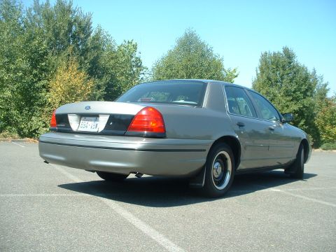 2000 Ford Crown Victoria - This 2000 Ford Crown Victoria is viewed from the rear, showing its distinctive black accent panel between the taillights.