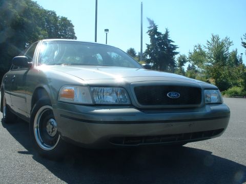 2000 Ford Crown Victoria - Front view of a 2000 Ford Crown Victoria parked outdoors on a sunny day.