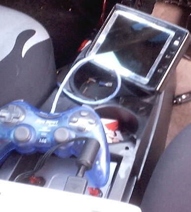 1999 Ford Taurus - A video game controller and a screen are visible inside the vehicle's interior.
