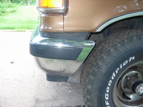 1988 Ford Bronco - Close-up of the rear corner of a 1988 Ford Bronco, showing the chrome bumper and a BFGoodrich tire.