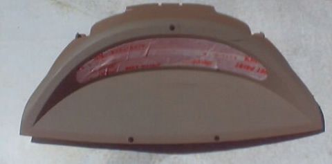 1999 Ford Taurus - Tan plastic third brake light housing with a red lens visible inside.