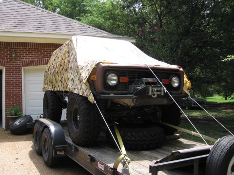 1967 Ford Mustang - A 1974 Ford Bronco, modified for off-road use, is secured to a trailer for transport.