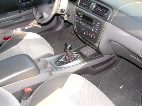 1992 Ford Taurus - The interior of a car is shown, focusing on the center console and dashboard area.