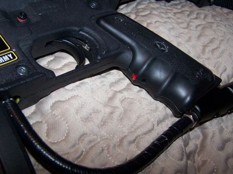 1986 Ford Bronco - This is a close-up view of a paintball gun's grip and trigger mechanism, not a vehicle.