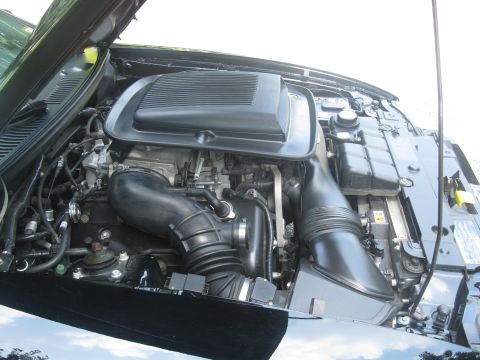 2003 Ford Mustang - Engine bay of a 2003 Ford Mustang, showing the V8 engine and air intake.
