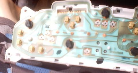 1999 Ford Taurus - Close-up of a vehicle's dashboard circuit board, showing intricate wiring and electronic components.