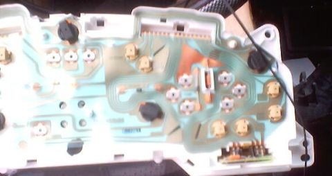 1999 Ford Taurus - Close-up of a vehicle's internal circuit board, showing electrical components and wiring.