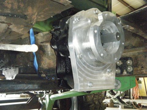 1978 Ford Bronco - A custom adapter plate is installed on a vehicle's transmission, likely a truck's, transmission system.