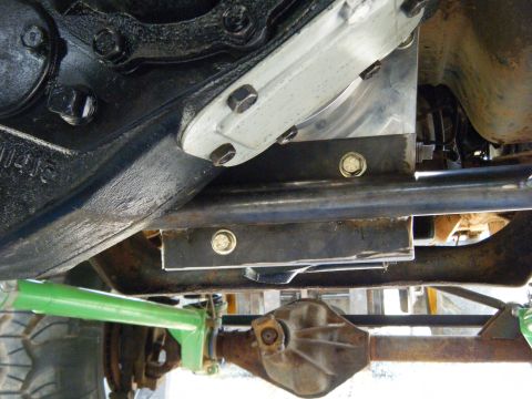 1978 Ford Bronco - Close-up of the vehicle's undercarriage, highlighting mechanical components and suspension system.