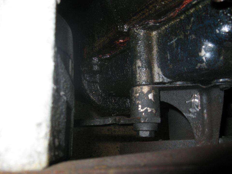 The Ford FE low mount Alternator adjustment bracket attaches to this boss on the timing cover. Earlier FE's from high mount applications may not have this boss on the cover.