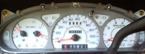 1999 Ford Taurus - Dashboard gauges show fuel, temperature, speed, RPM, and odometer readings.
