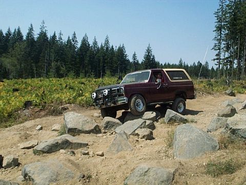 1986 Ford Bronco - This Ford Bronco is navigating a rocky off-road course on a sunny day.