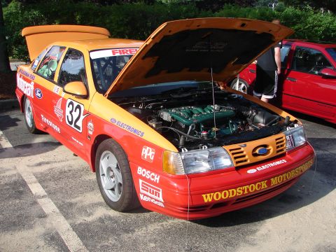 1992 Ford Taurus - This 1992 Ford Taurus SHO race car displays its engine with the hood open at a car show.