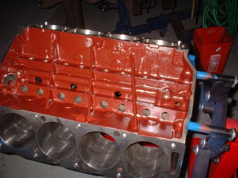 1968 Ford Galaxie - A freshly painted engine block is ready for assembly, with cylinder bores clearly visible.