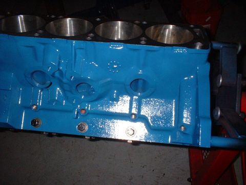 1968 Ford Galaxie - A blue engine block is shown with visible cylinder bores and mounting bolts.