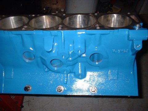 1968 Ford Galaxie - Engine block painted bright blue, showing cylinder bores and casting marks.
