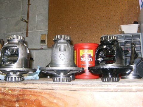 2000 Ford E350 - Differential gears are displayed on a shelf next to a coffee can and a tool organizer.