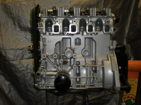 2009 Suzuki Samurai - Engine block with oil filter visible, mounted on an orange stand against a dark background.