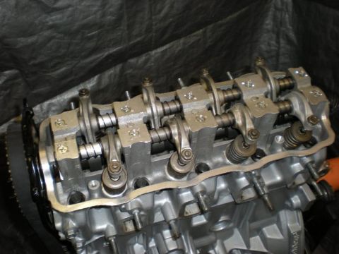 2009 Suzuki Samurai - This is a close-up view of an engine's cylinder head, showing internal components like rocker arms and valves.