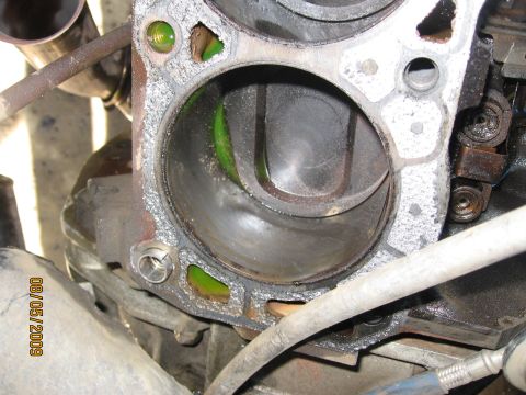 1994 Ford Bronco - Close-up of an engine cylinder, showing internal wear and green fluid. The image is dated August 5, 2009.