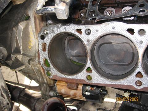 1994 Ford Bronco - Engine block showing cylinders and pistons, with evidence of recent work or disassembly.