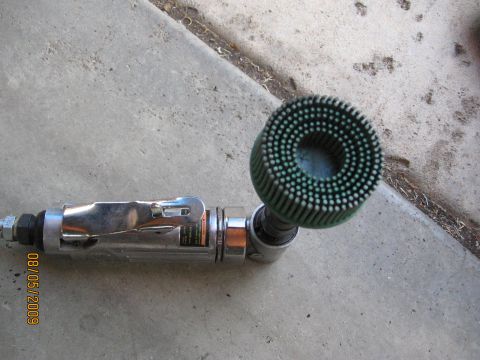 1994 Ford Bronco - A close-up of a rotary tool and its brush attachment, dated August 5, 2009.