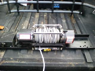 1983 Ford Ranger - A winch is shown installed in the bed of a pickup truck.