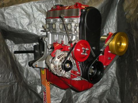 Suzuki Samurai - This engine assembly features red painted components and a gold colored pulley.