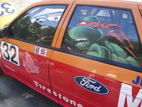 1992 Ford Taurus - Race car with custom decals and a Teenage Mutant Ninja Turtle sticker on the window.