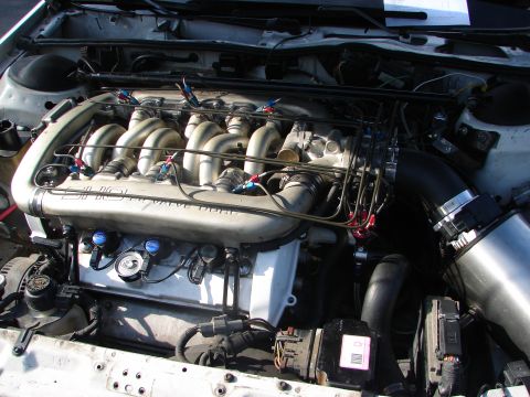 1992 Ford Taurus - Close-up view of a SHO 32-valve DOHC engine, likely from a Ford Taurus, with custom modifications.