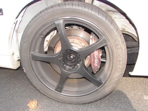 1992 Ford Taurus - The vehicle features aftermarket Wilwood brake calipers behind its custom wheels.
