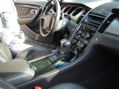 1992 Ford Taurus - The interior of a modern car features a dashboard with a prominent infotainment system and climate controls.