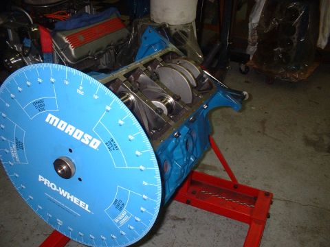 1968 Ford Galaxie - A blue Moroso Pro-Wheel is positioned in front of an engine block, likely for timing adjustments.