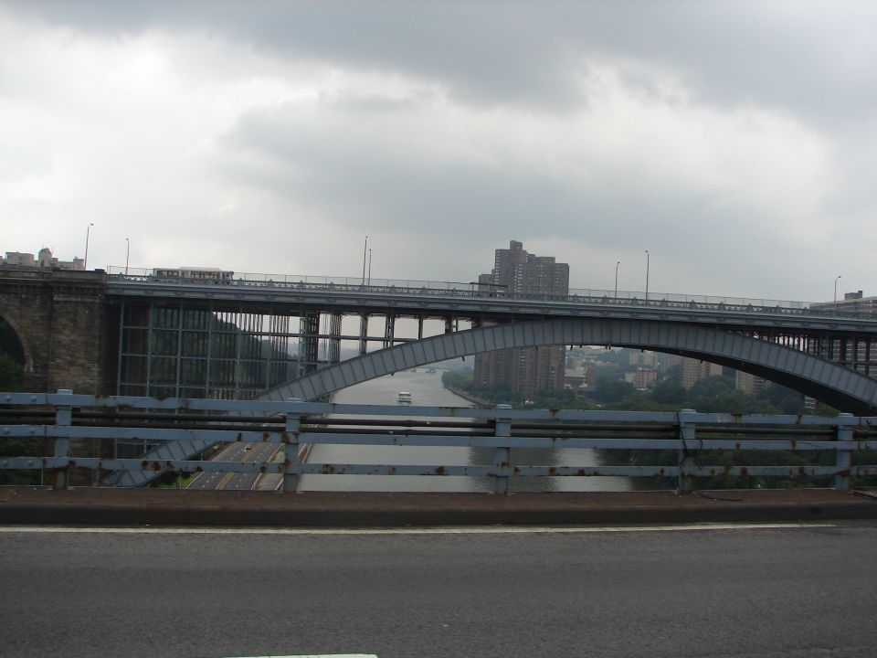 Bridge over a river with buildings in the background