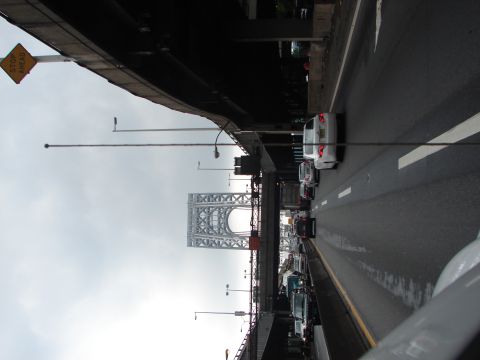 1992 Ford Taurus - A view of traffic on a highway with a large bridge structure in the distance.