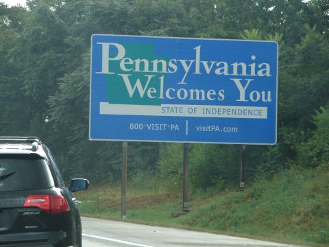 1992 Ford Taurus - Entering Pennsylvania on the highway, passing a state welcome sign.